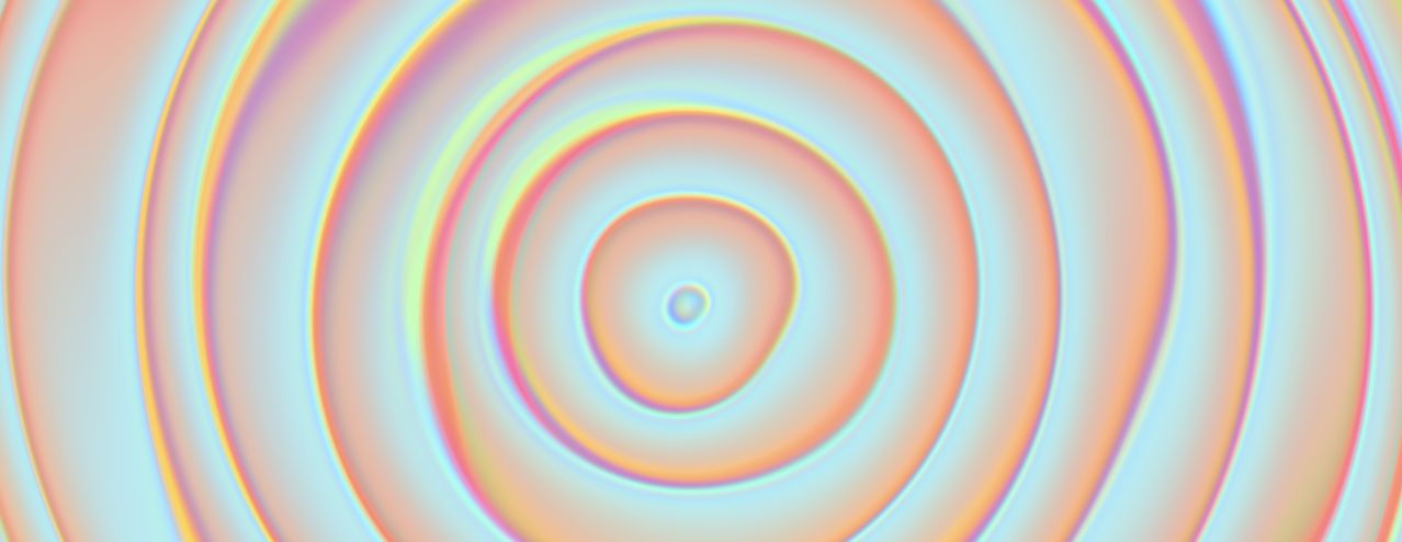 Pastel cyan, coral, and gold folds radiating through the pearlescent light field of Opalia.